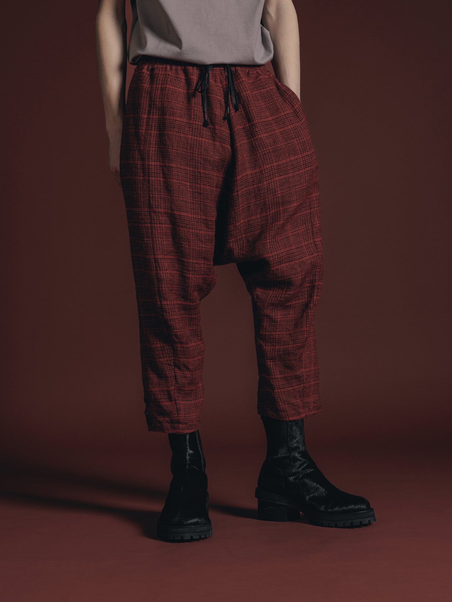 
                  
                    WOOL/LINEN RED PLAID DROP CROTCH TROUSERS
                  
                