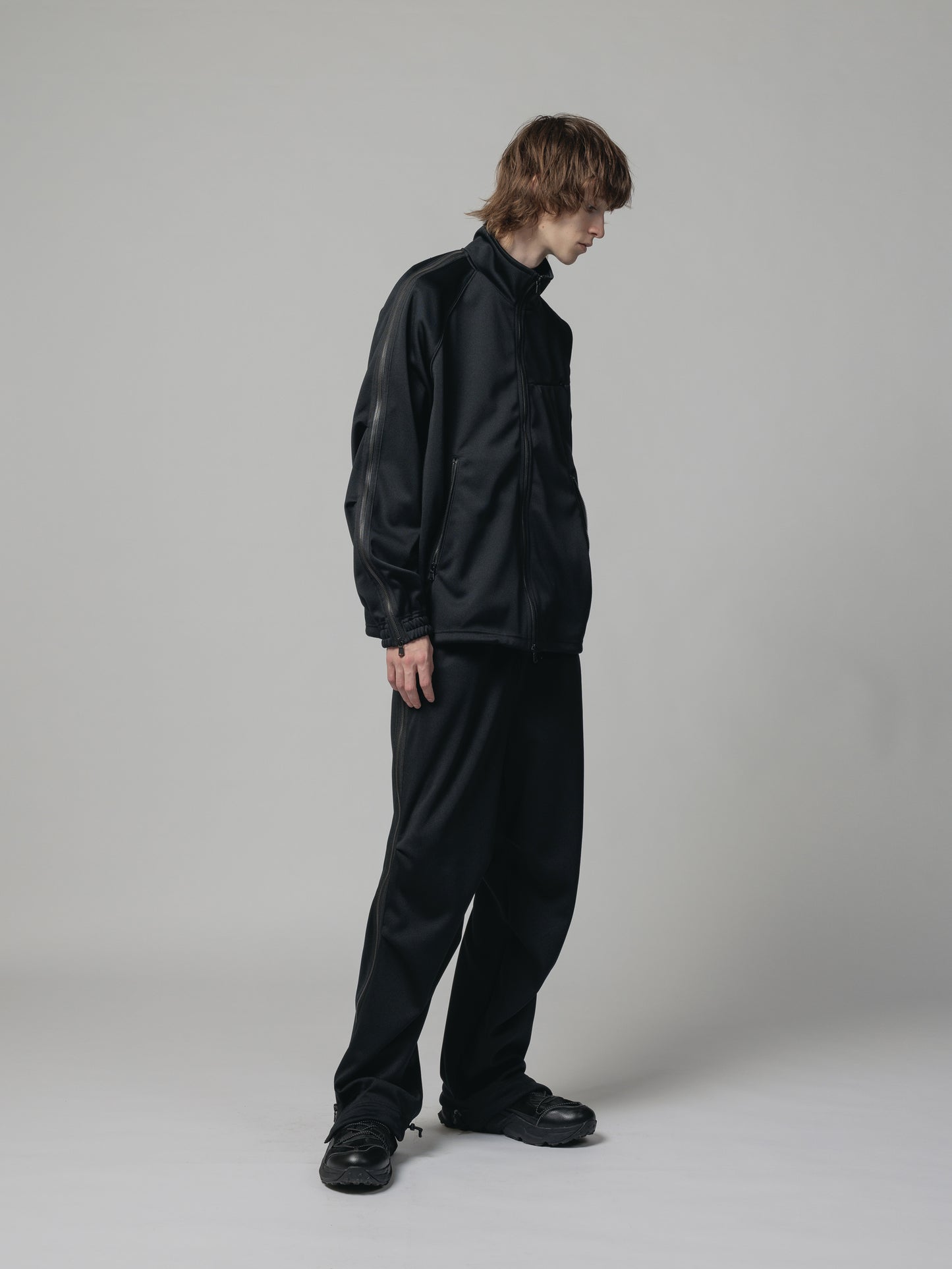 
                  
                    EXCLUSIVE TRACK PANTS
                  
                
