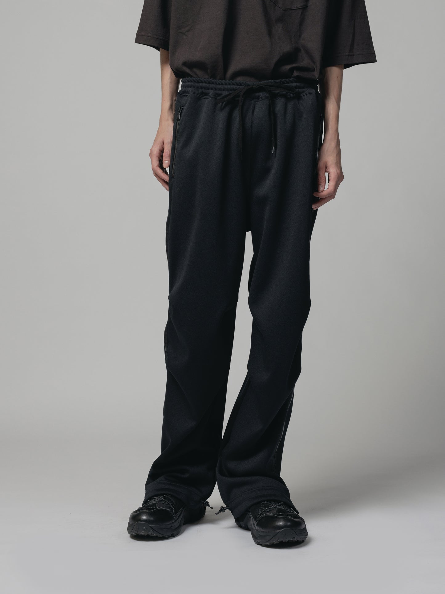 
                  
                    EXCLUSIVE TRACK PANTS
                  
                
