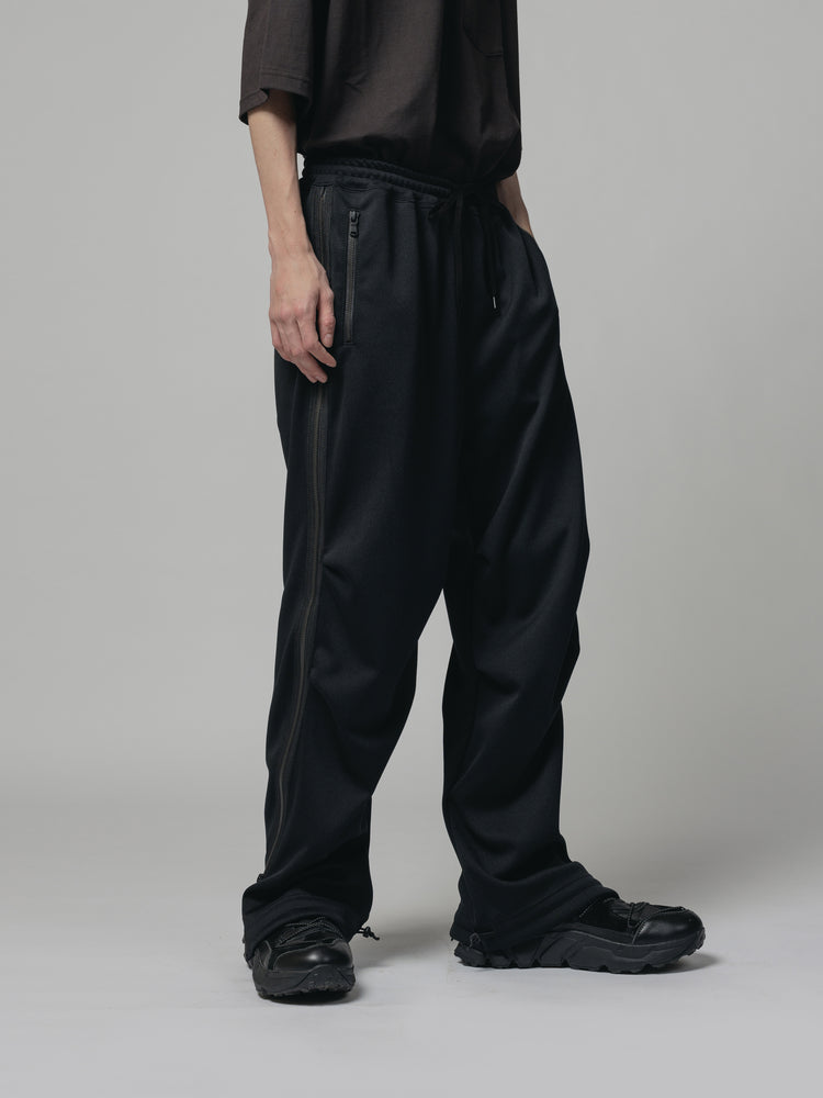 
                  
                    EXCLUSIVE TRACK PANTS
                  
                