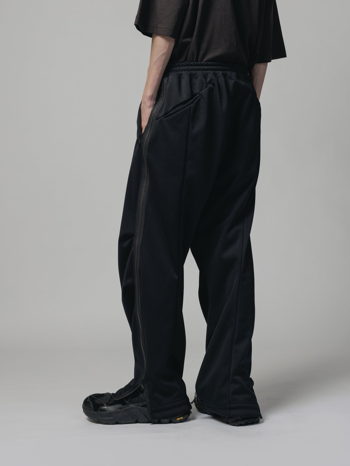 
                  
                    EXCLUSIVE TRACK PANTS
                  
                