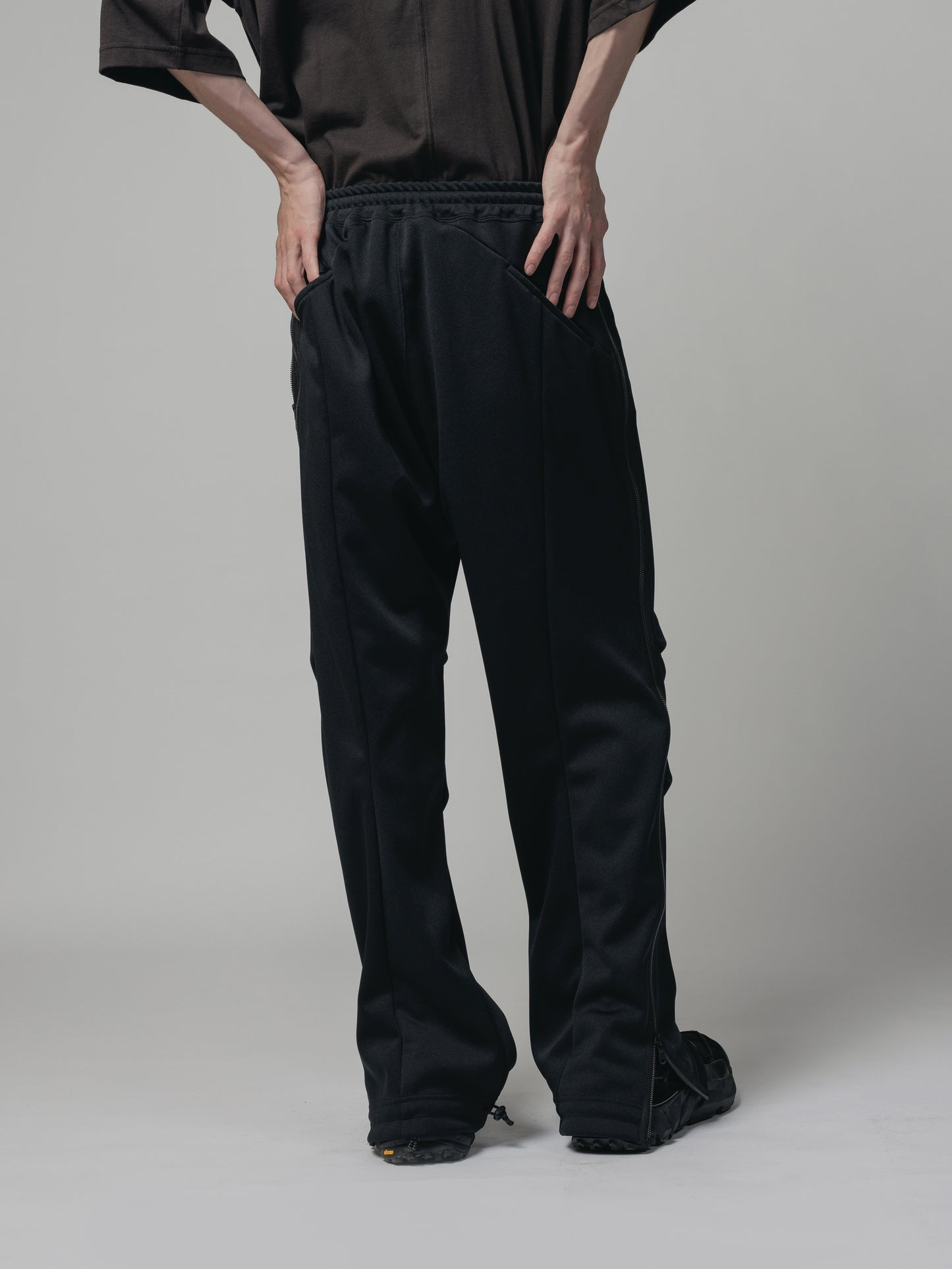 
                  
                    EXCLUSIVE TRACK PANTS
                  
                
