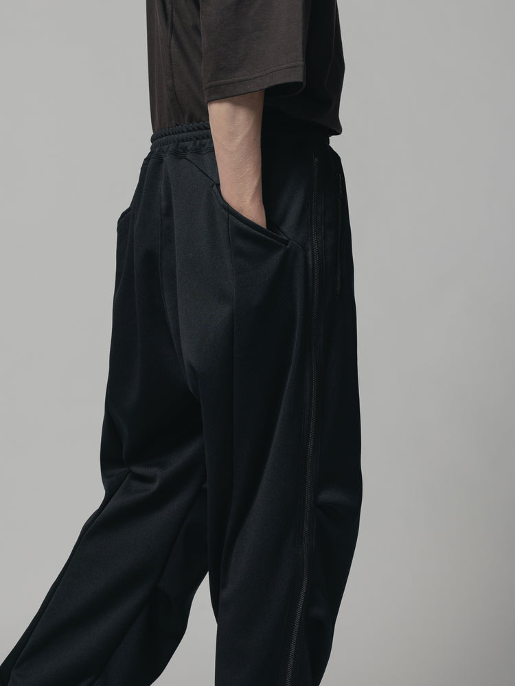 
                  
                    EXCLUSIVE TRACK PANTS
                  
                