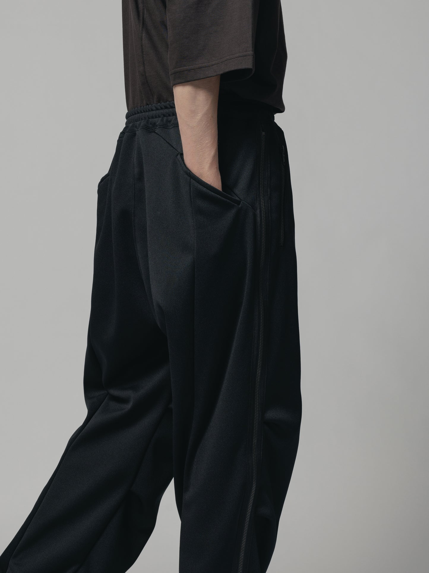 
                  
                    EXCLUSIVE TRACK PANTS
                  
                