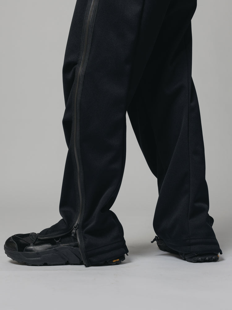 
                  
                    EXCLUSIVE TRACK PANTS
                  
                