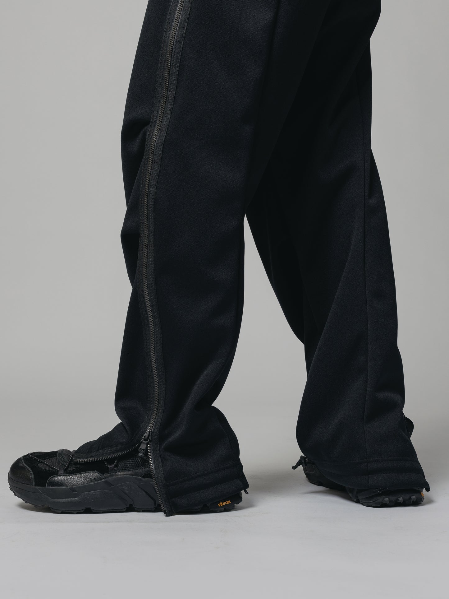 
                  
                    EXCLUSIVE TRACK PANTS
                  
                