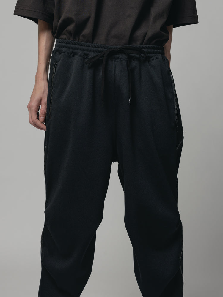 
                  
                    EXCLUSIVE TRACK PANTS
                  
                