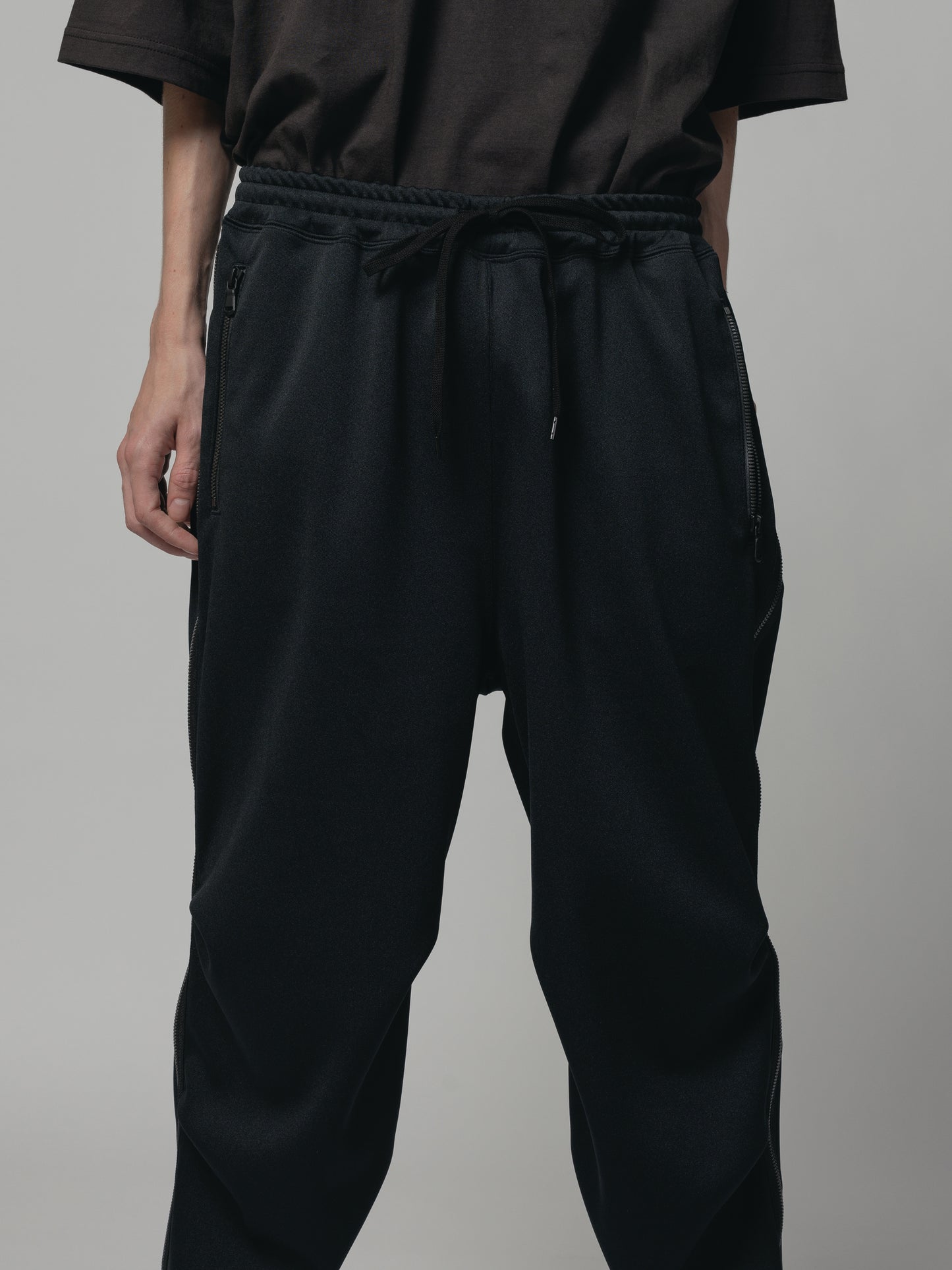 
                  
                    EXCLUSIVE TRACK PANTS
                  
                