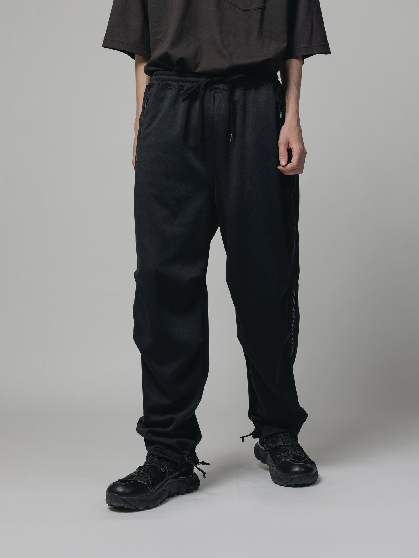 
                  
                    EXCLUSIVE TRACK PANTS
                  
                