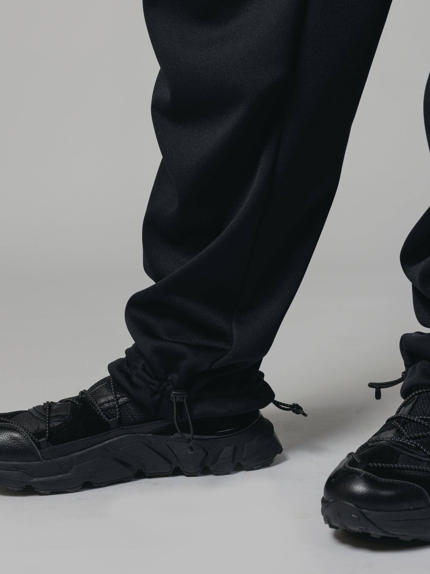 
                  
                    EXCLUSIVE TRACK PANTS
                  
                