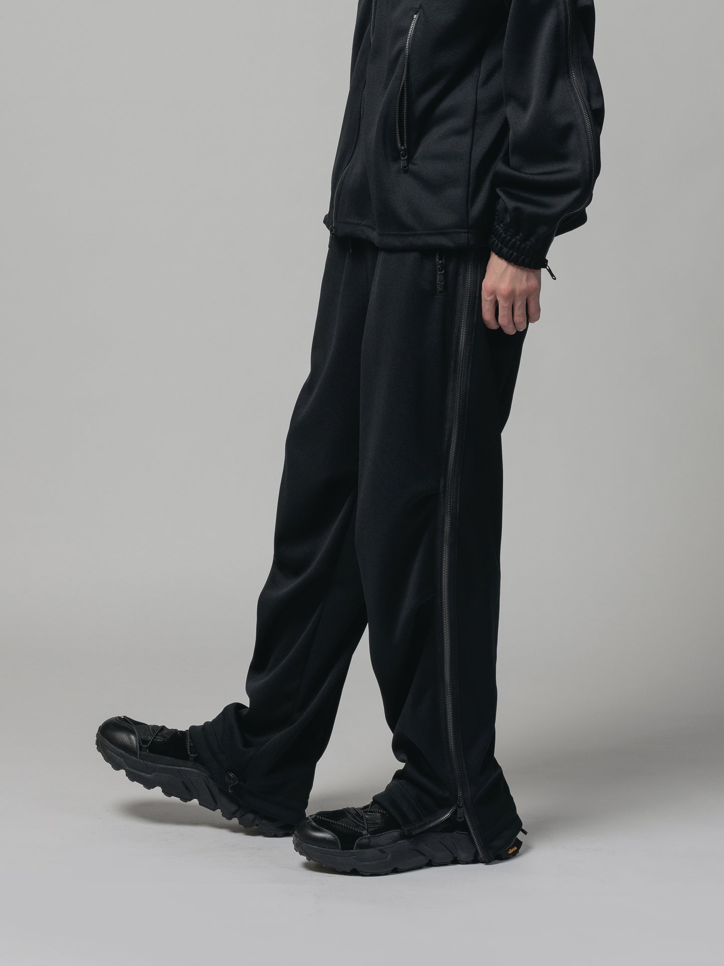 
                  
                    EXCLUSIVE TRACK PANTS
                  
                